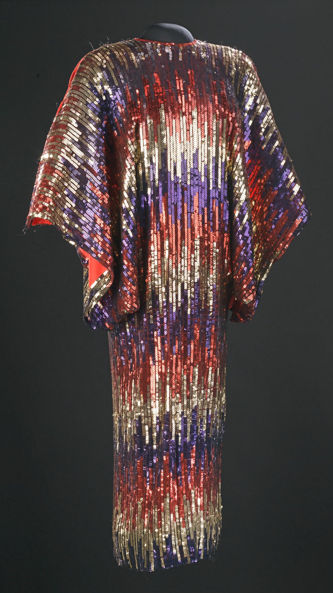 A colorful ruffled stage dress worn by Celia Cruz on museum display