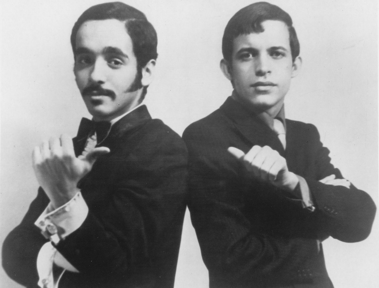 Black and white publicity photo of Willie Colón and Héctor Lavoe in suits